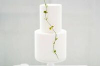 68 a pure white minimalist wedding cake decorated with a single fresh twig is amazing for a spring wedding