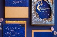 a bright blue and gold wedding invitation suite with white letters, gold stars and various 3D detailing is a cool idea