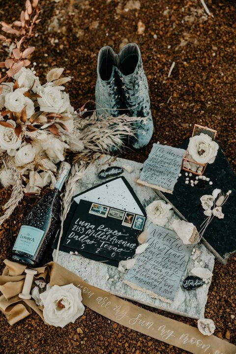 a celestial wedding invitation suite in black, grey and white, with a watercolor effect and calligraphy is amazing