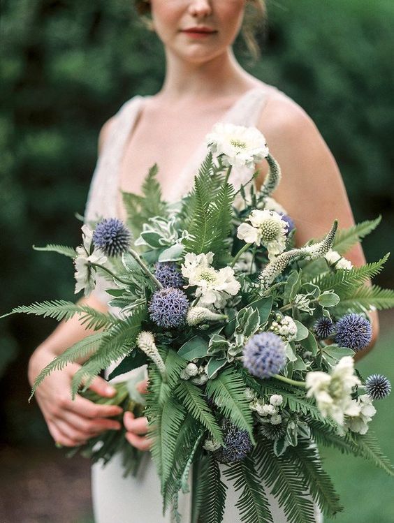 a dreamy wedding bouquet of fern, allium, white blooms is a very airy and romantic idea for a garden bride