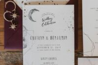 a gorgeous celestial wedding invitation suite with a burgundy envelope, white invites and watercolors, gold foil is wow