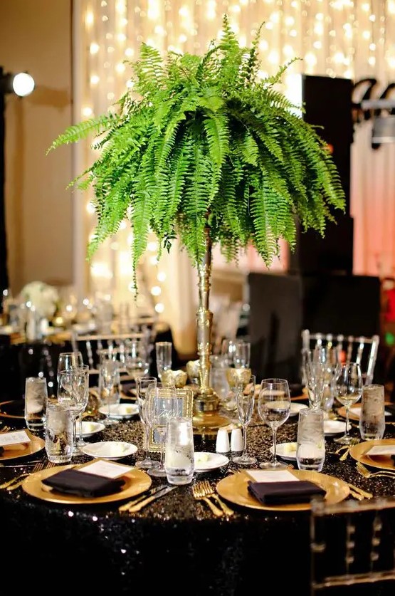 a lush and tall fern wedding centerpiece is great not only for tropical but for glam and art deco weddings, too