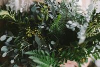 a pretty textural wedding bouquet of various types of greenery including fern is a great idea for a modern bride