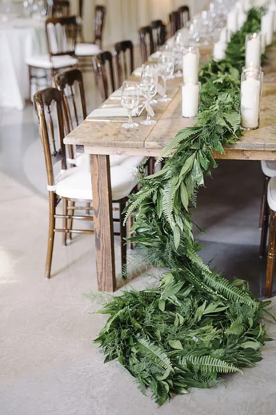 a simple leafy table runner with ferns for a rustic or natural table setting will bring texture