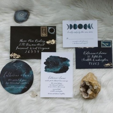 a stylish celestial wedding invitation suite done in navy, teal and with constellations and moon phases