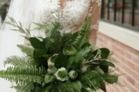 a stylish wedding bouquet of fern, leaves, white callas and seed pods is a cool idea for a woodland bride