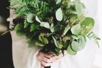 a stylish wedding bouquet with ferns and seeded eucalyptus looks very chic and very textural