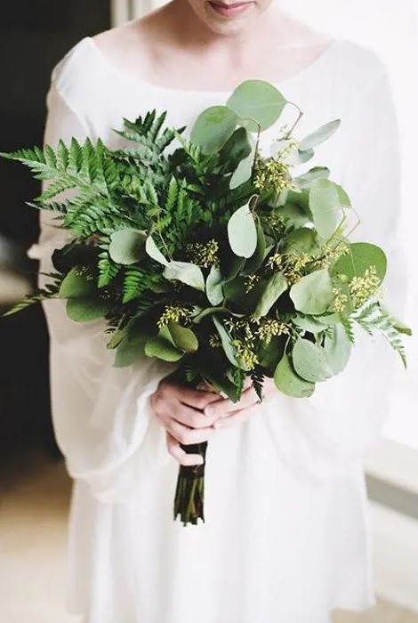 a stylish wedding bouquet with ferns and seeded eucalyptus looks very chic and very textural