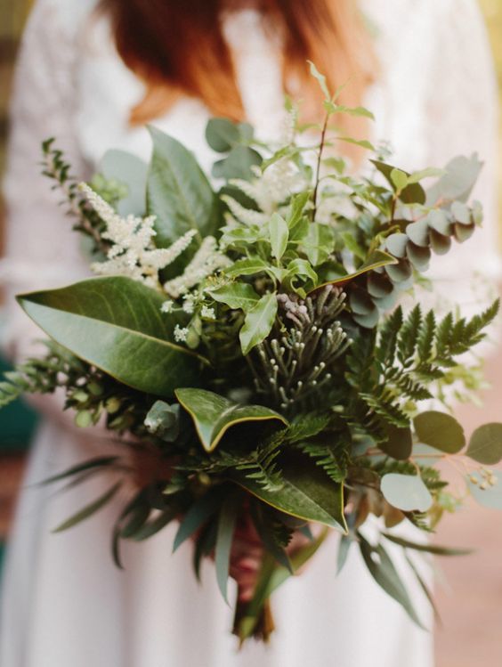 a textural wedding bouquet of fern, white blooms and foliage is a lovely idea for a casual bride, it looks catchy and bold