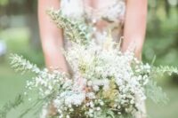 an airy spring woodland wedding bouquet of eucalyptus, ferns, baby’s breath and herbs is a lovely idea