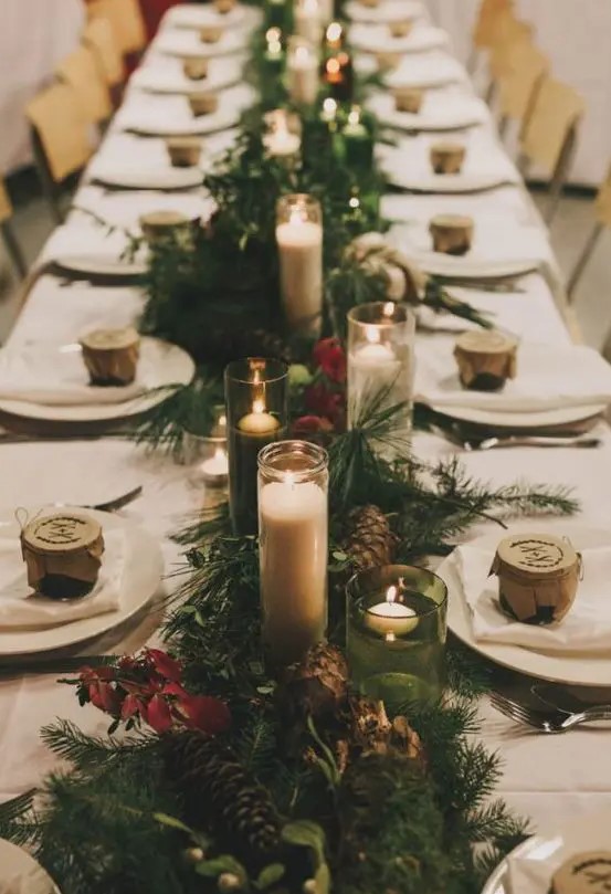 evergreens, pinecones, red leaves and lots of candles for a forest winter wedding