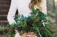 such a bold wedding bouquet with ferns and berries will contrast your white wedding gown