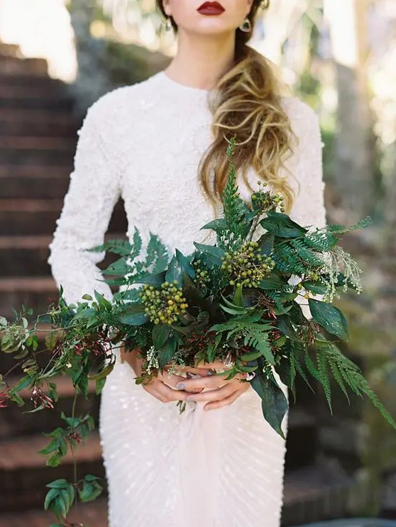 such a bold wedding bouquet with ferns and berries will contrast your white wedding gown