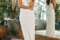 02 a modern relaxed plain slip wedding dress with a deep V-neckline plus statement earrings for an edgy look