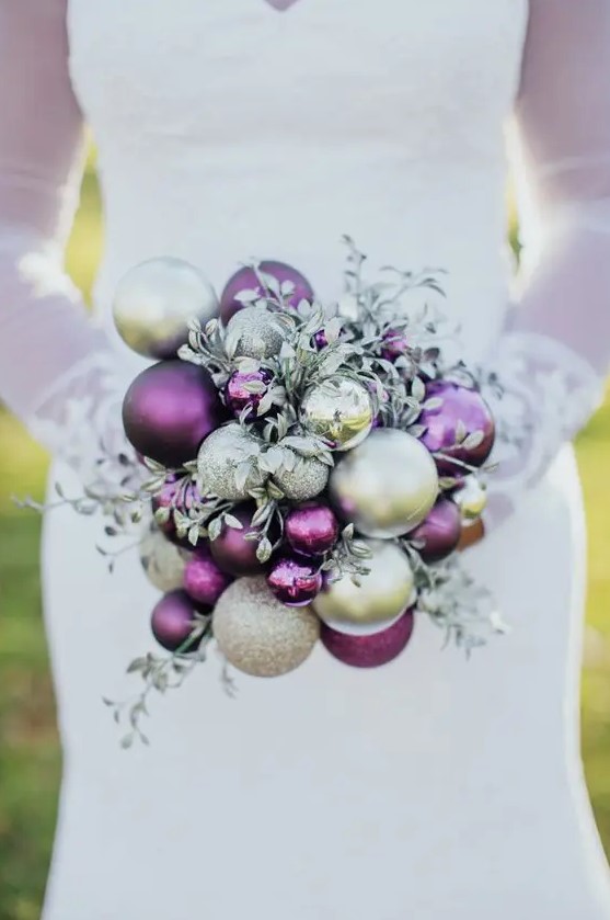 a bright winter wedding bouquet of metallic, glitter and purple ornaments and silver foliage is a great and bold idea