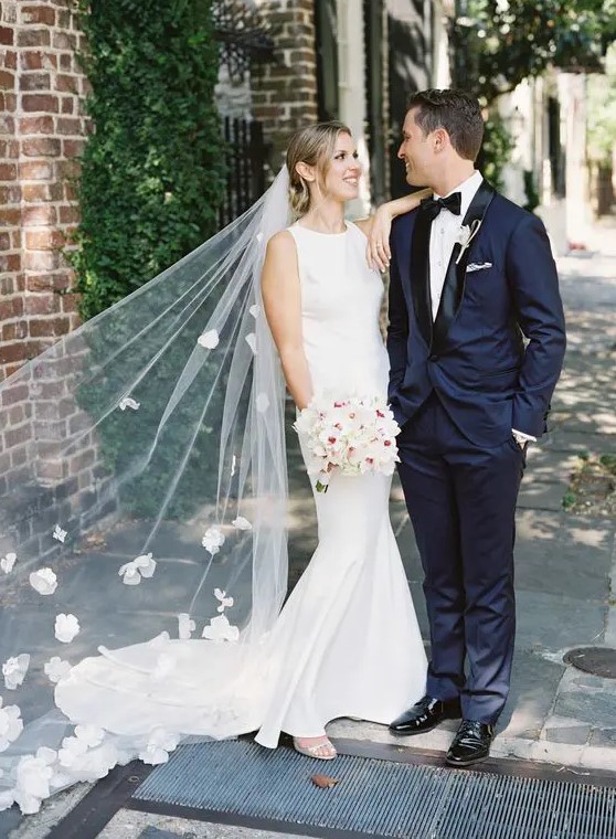 a chic veil with fabric flowers and trim is a beautiful accessory for a spring or garden feel