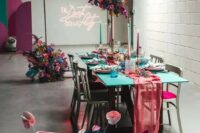 04 a colorful wedding reception space decorated in hot pink, fuchsia, turquoise, blue, violet, with blooms, cages and candles