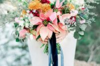 04 a lovely wedding bouquet of pink poinsettias, mustard, pink and white blooms, greenery and thistles is a beautiful idea