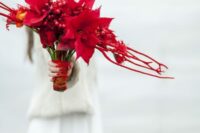 a bold red winter wedding bouquet