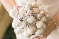 05 a delicate winter wedding bouquet made of white, silver and pink ornaments and silver faux berries and leaves is wow