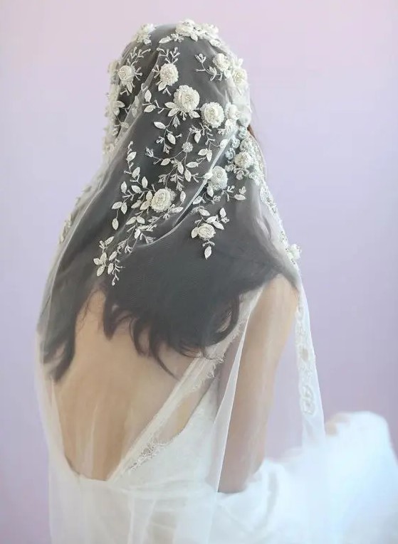 a gorgeous veil with realistic floral and leaf appliques of lace and beads for a romantic bride
