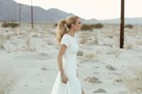 05 a minimalist short sleeve wedding dress with a front slit and a high neckline