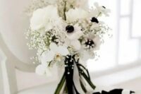 06 a chic black and white wedding bouquet of white orchids, roses and anemones, baby’s breath, some black and white ribbons
