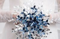 06 a unique rhinestone wedding bouquet of white, silver and blue pieces composing flowers and leaves is a gorgeous idea