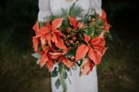 07 a bold winter wedding bouquet of evergreens, foliage, berries and poinsettias is a lovely idea for a Christmas or winter bride