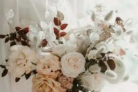 10 a soft pastel wedding bouquet with white and blush blooms plus herbs and orange ribbons for a delicate look
