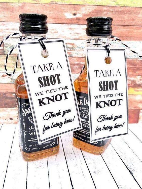 mini alcohol bottles with tags are a unversal wedding favor for any wedding, where children aren't allowed