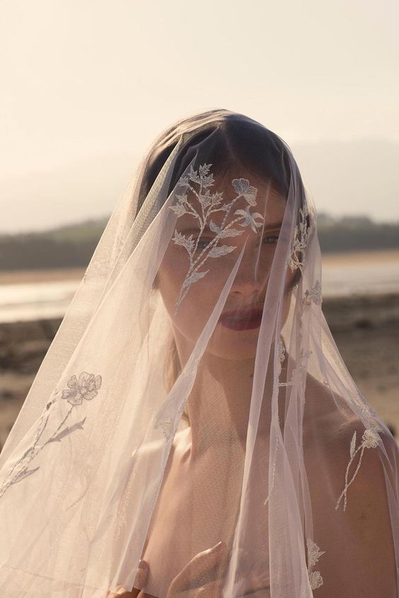 a refined and chic cathedral veil with white floral embroidery is a beautiful solution for a vintage bridal look