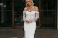15 a modern mermaid fully embellished off the shoulder wedding dress with a long train will bring a touch of sparkle
