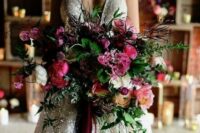 16 a colorful and lush winter wedding bouquet in pink, purple, withmuch greenery and texture for a colorful NYE wedding