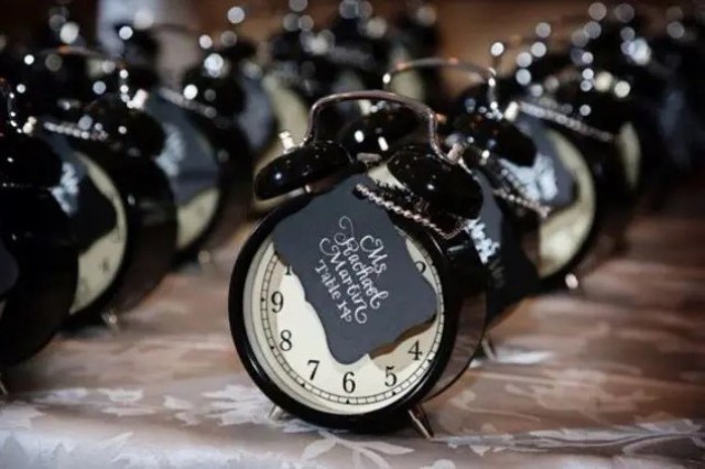 black clocks with black tags are cool and easy NYE wedding favors, they look cool and will be to the point for any style