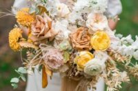 20 a delicate and pretty fall wedding bouquet of yellow, blush, rust blooms, greenery and dried foliage for a subtle fall bridal look