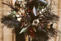 20 a glam wedding bouquet with gilded flowers and succulents, black leaves and feathers, foliage and leaves for a NYE bride