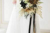 21 a gold and black wedding bouquet with black and gilded succulents, greenery and gilded leaves and black and gold ribbons for a NYE bride