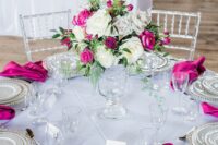 22 a contrasting wedding tablescape in neutrals and with magenta napkins plus a white and magenta flower centerpiece is amazing