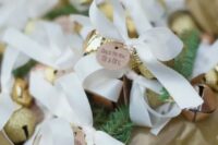 22 gold glitter jingle bells with ribbon bows can be used as decorations and as favors, too
