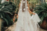 23 a floral wedding dress and a neutral cathedral veil accented with fresh orchids are a fantastic and very girlish combo for a wedding