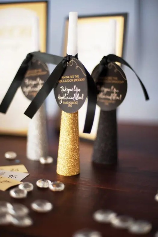 metallic and black glitter noisemakers will be great for New Year nuptials, make some yourself or buy ready ones