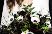 24 a moody bouquet with deep purple and white blooms and greenery is a lovely idea for a black and white NYE wedding