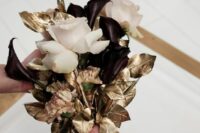 25 a refined NYE wedding bouquet with blush roses, deep purple callas and gilded leaves is a pretty idea for a glam NYE bride
