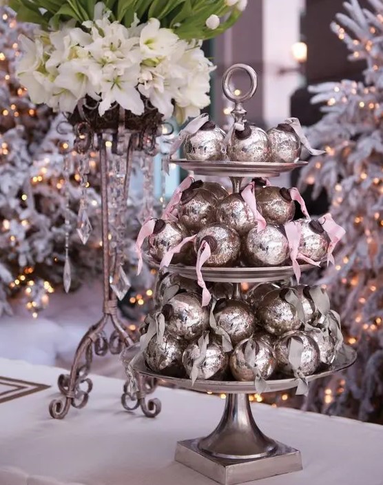 place some cute Christmas ornaments on a cake stand, they are perfect for budget-friendly favors