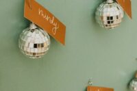 26 silver disco balls with tags are a great idea for a disco-themed or NYE wedding, they are easy to get and won’t break the budget