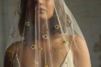 27 a super delicate and subtle veil accented with fresh white and yellow blooms and twigs is a beautiful idea for a boho bride