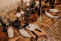 32 a beautiful Western wedding tablescape with pampas grass, rust roses, rust and black candles and white porcelain