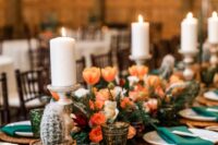 34 a Western wedding tablescape with orange blooms, potted cacti, candles, woven placemats, emerald napkins is amazing
