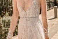 35 a lovely wedding dress, fully sheer and embellished, with a lace bodysuit under it is a very dreamy idea